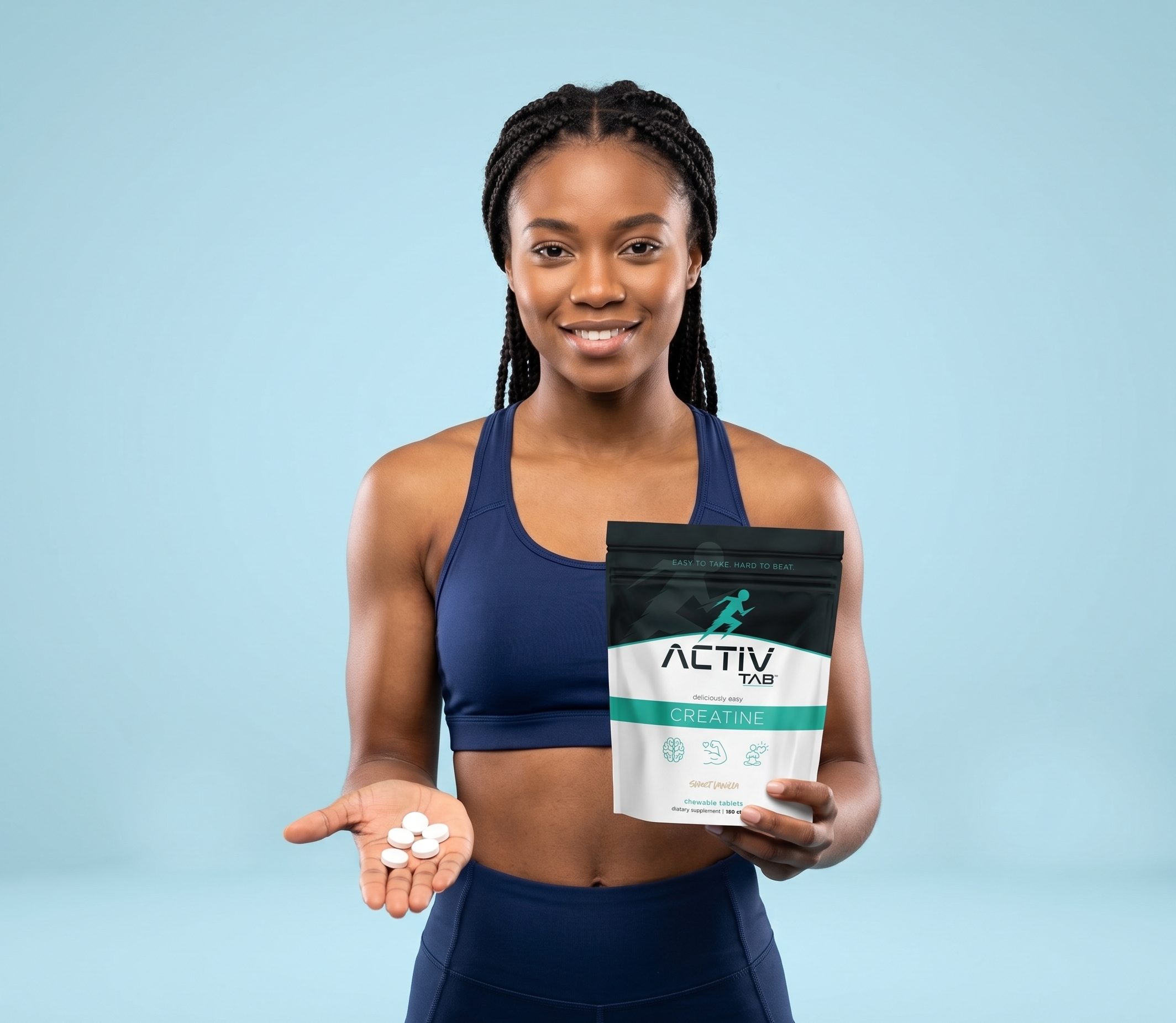 Woman holding a package of Activtab Creatine with supplements on a light blue background